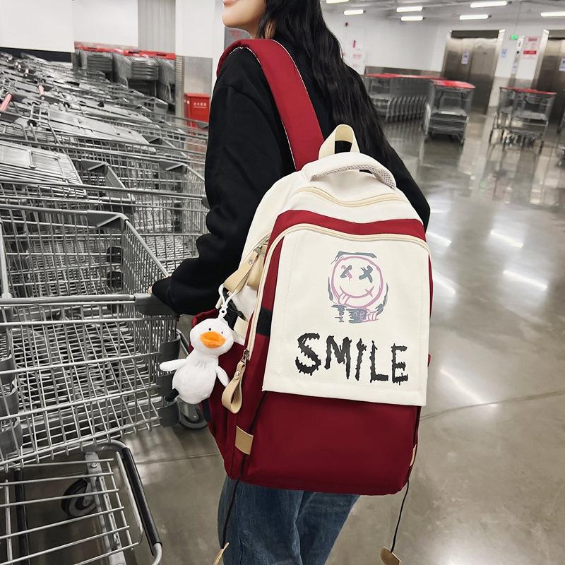 Schoolbag new student backpack casual large-capacity computer bag Korean version cute smiley face couple schoolbag manufacturer wholesale