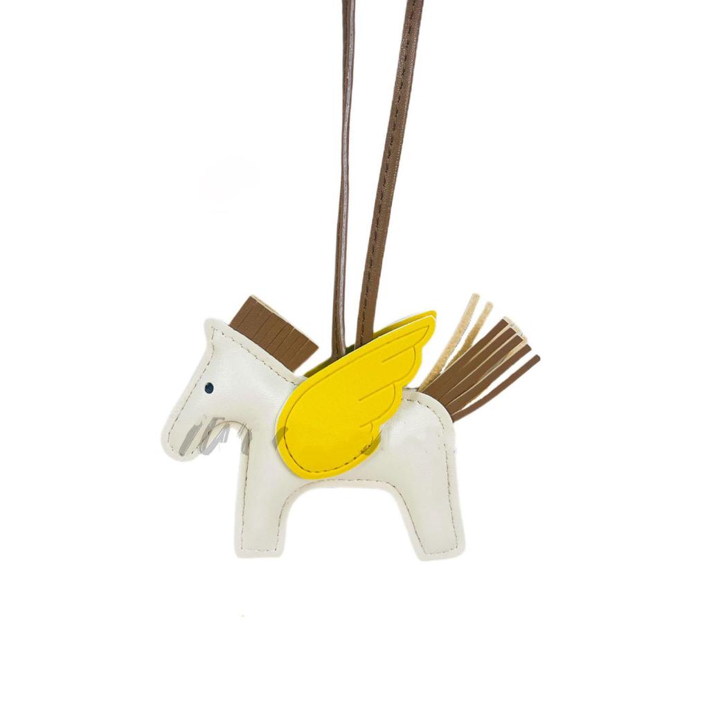 Portachiavi con ciondolo Pegasus a contrasto con motivo a cartone animato, con nappa e pony in pelle