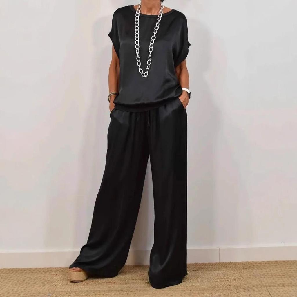 Set Top Bianco a Vestibilità Rilassata e Pantaloni a Gamba Larga a Vita Alta