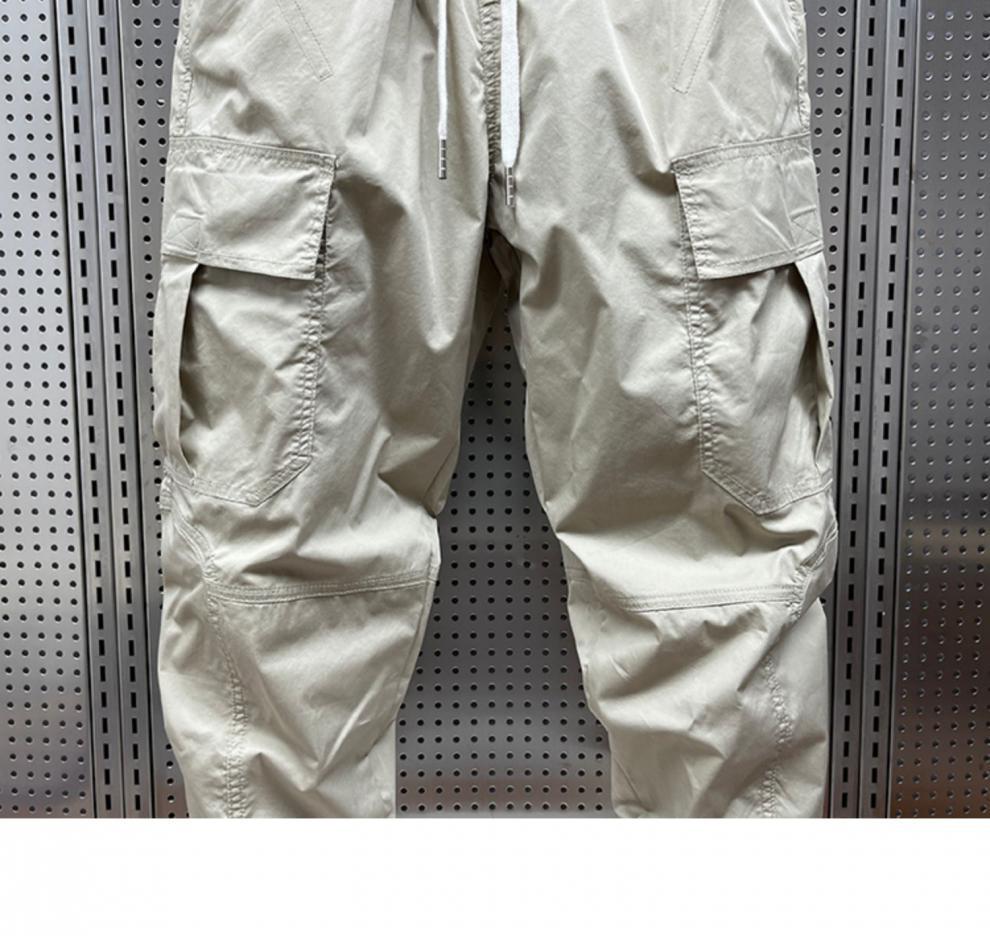 Men's Tapered Quick-Dry Elastic Cargo Pants with Drawstring, Multi-Pocket, Casual Trendy 9-Point Style for Spring and Autumn.
