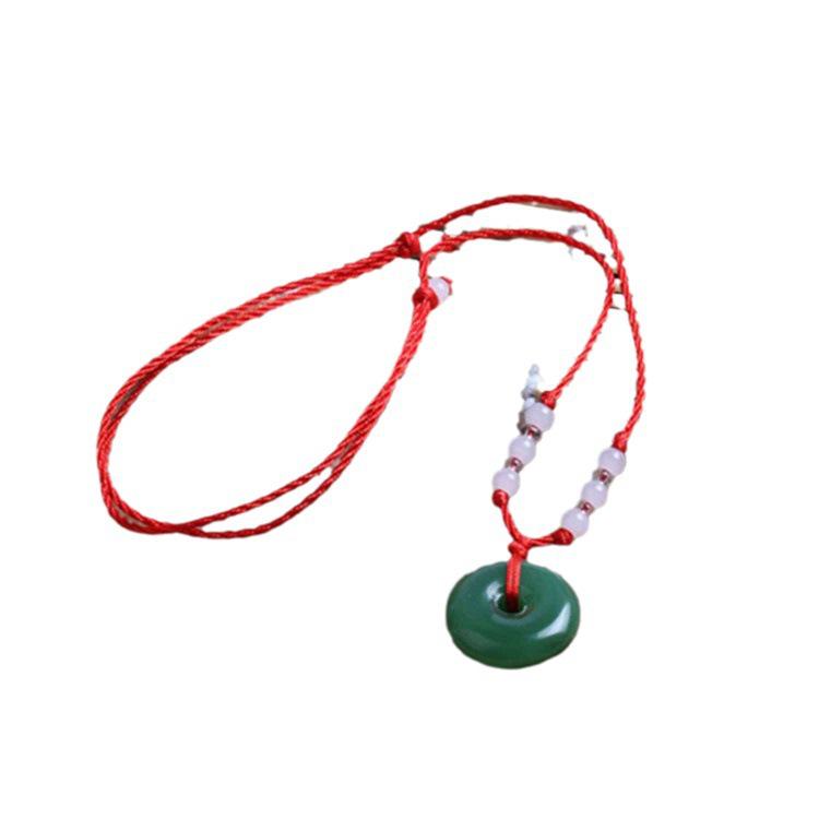 Hetian Jade Guanyin Buddha Pendant Necklace with Red String and Eight Bead Design.