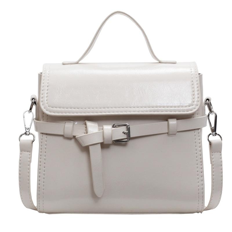 Trend niche high-end sense solid color versatile portable small square bag women's commuting simple oil wax leather messenger bag