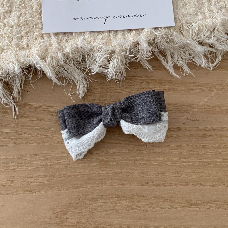 

1 textured gray with bow hair clip girl lace splice streamer half tied hair duck beak clip hair accessory Size fits all