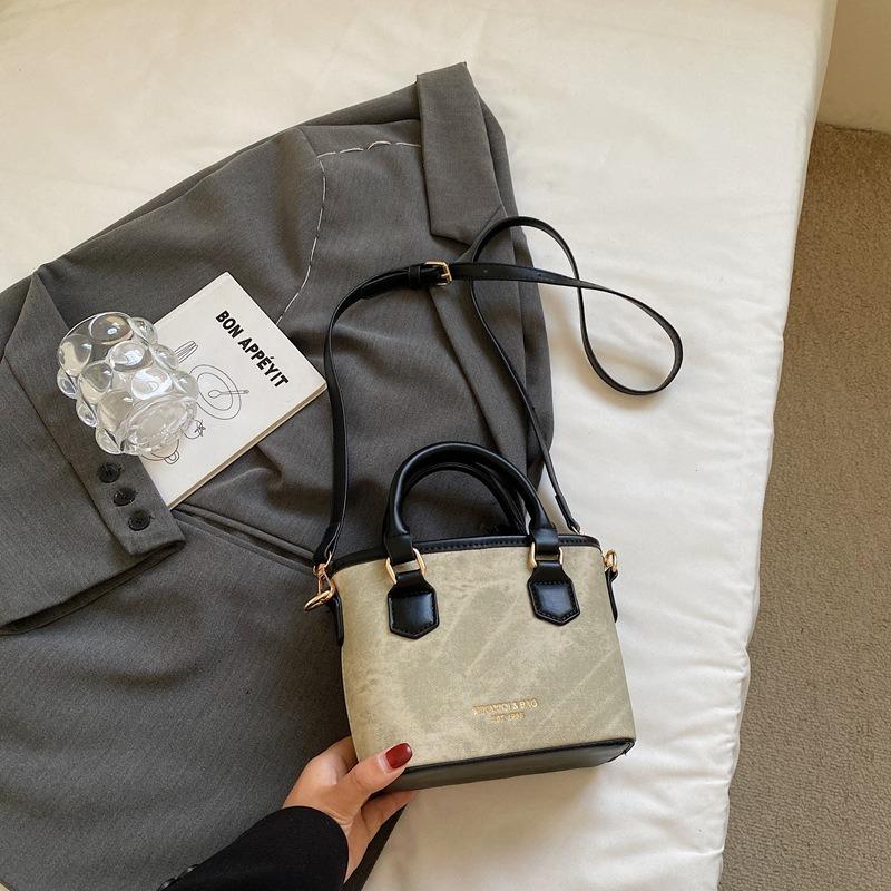 Textur trendige Nischentasche Herbst neu retro Schulter Umhängetasche Mode tragbare Eimertasche Damen