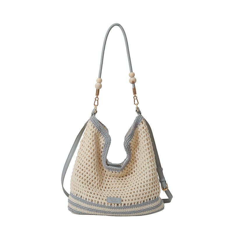 Fashion woven stripe contrast cut-out women's underarm bag spring new shopping bag shoulder crossbody bag