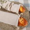 A reusable linen bread storage bag - an unbleached drawstring bag for the natural storage of homemade bread and pastries