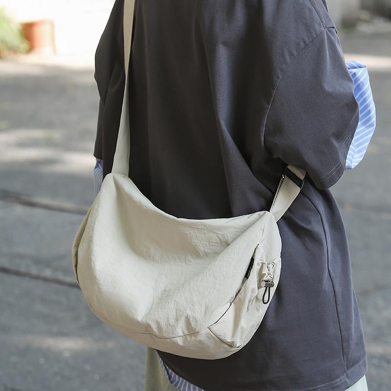 Bag women's large capacity 2025 new solid color casual shoulder messenger bag class commuting niche design dumpling bag