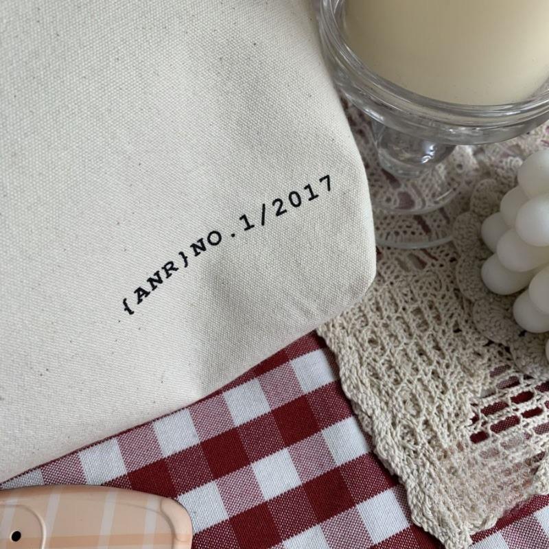 Niche Design, Large Capacity Canvas Bag with Artistic Appeal