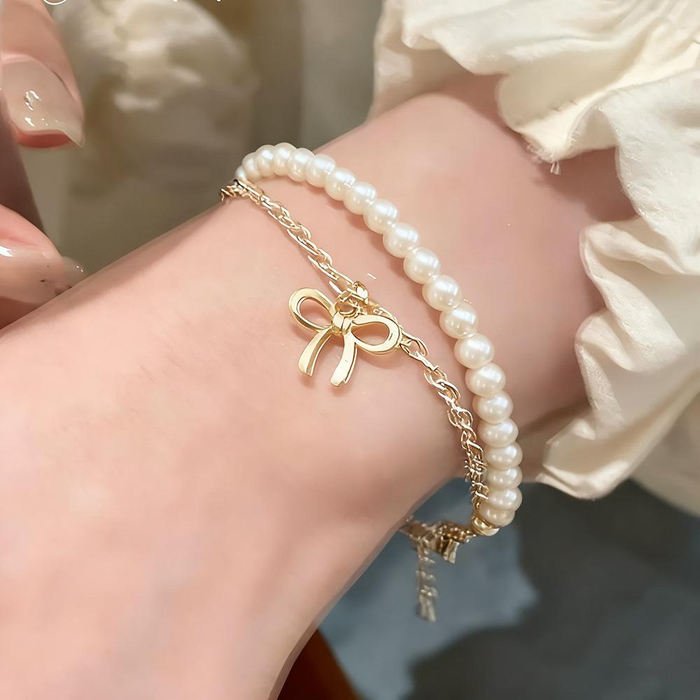 

Hot-selling creative bow imitation pearl bracelet set temperament double-layer stacked earrings women