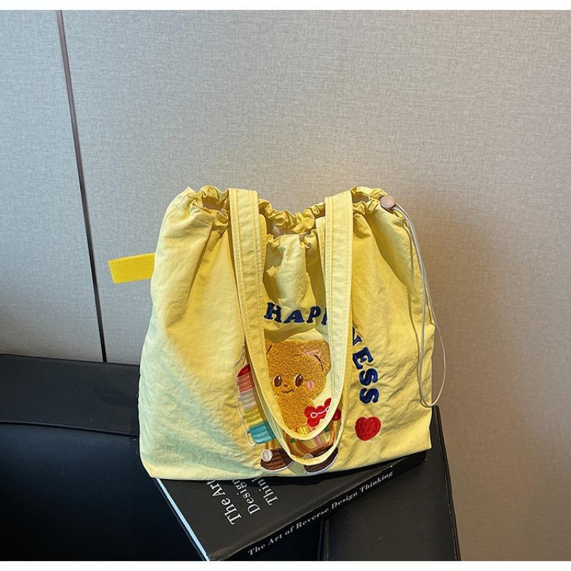 The new School of Arts and Art style is simple and large-capacity tote bag, and women's tide is popular. Versatile commuter shoulder bag.