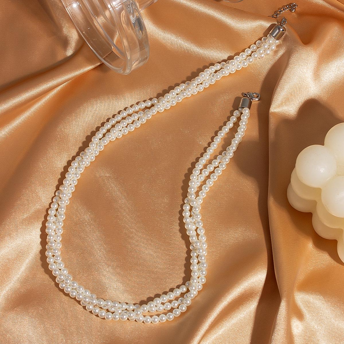 

Retro Pearl Clavicle Necklace with Multi-Layer Sweet Potato Design