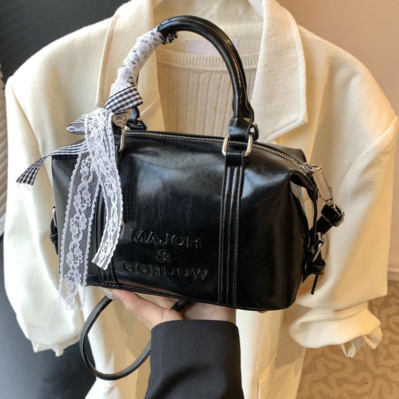 Fashion niche hand carry bowling bag women 2025 new Korean version trend high-end shoulder bag versatile messenger bag