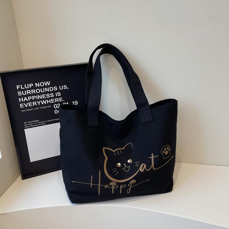 

2025 autumn new canvas bag portable shoulder large capacity cartoon cute fashion simple niche tote bag
