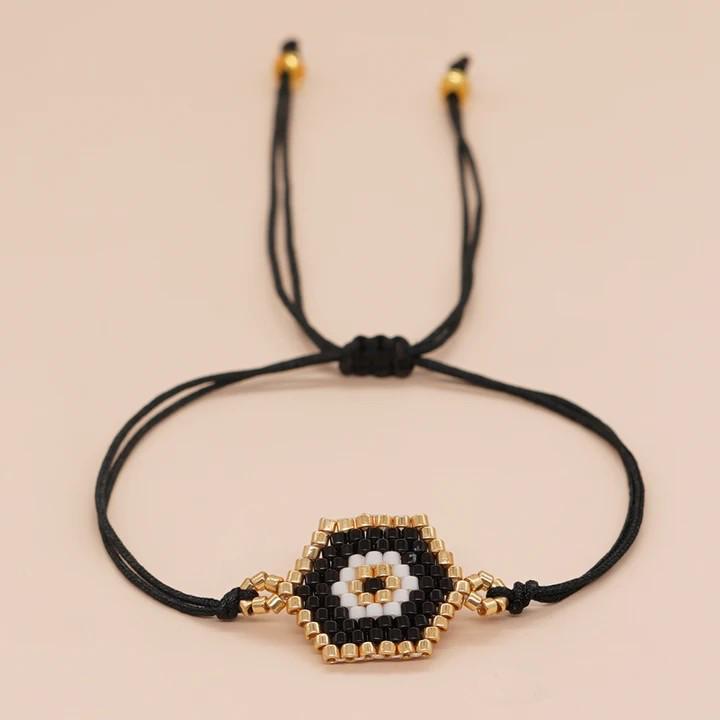 Bracelet en perles d'œil du diable tissé à la main avec motif de niche en verre