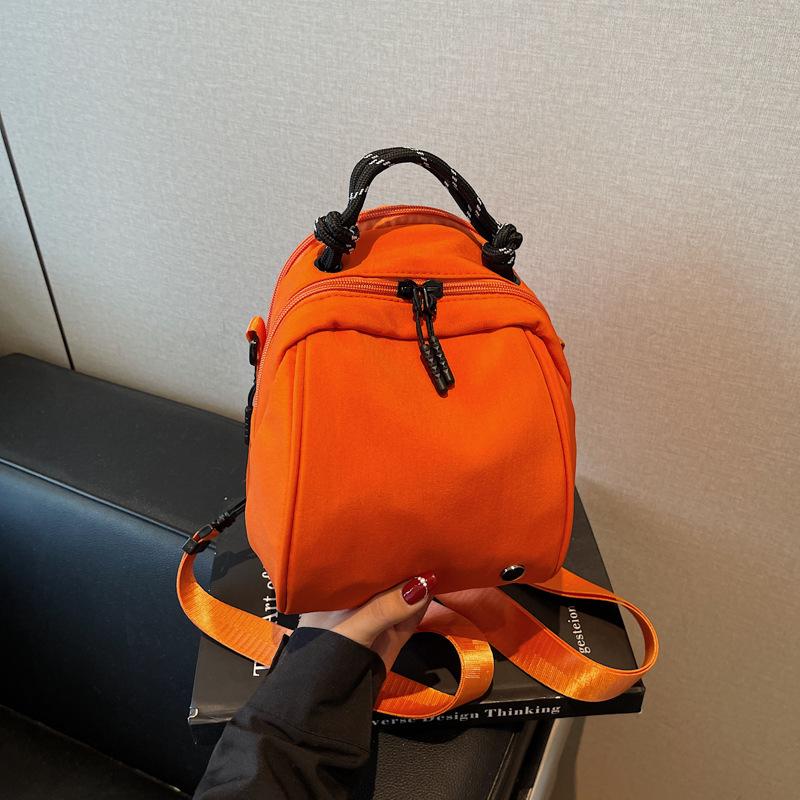 

Lightweight waterproof simple portable shoulder bag new women s bag design versatile double shoulder shell bag backpack оранжевый