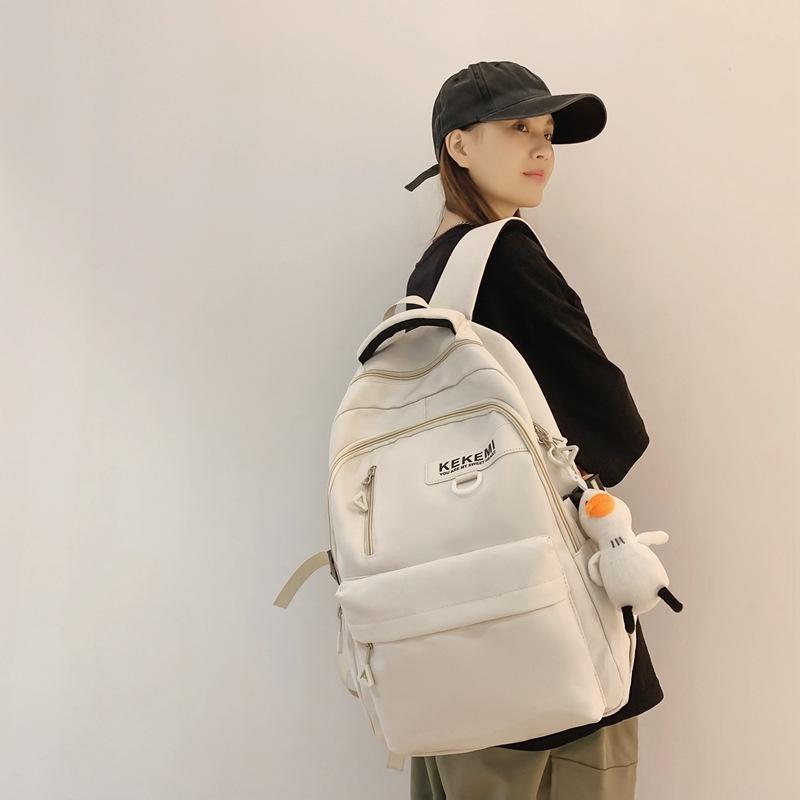 Schoolbag backpack men's 1011 new versatile large-capacity college backpack girls simple junior high school high school bag