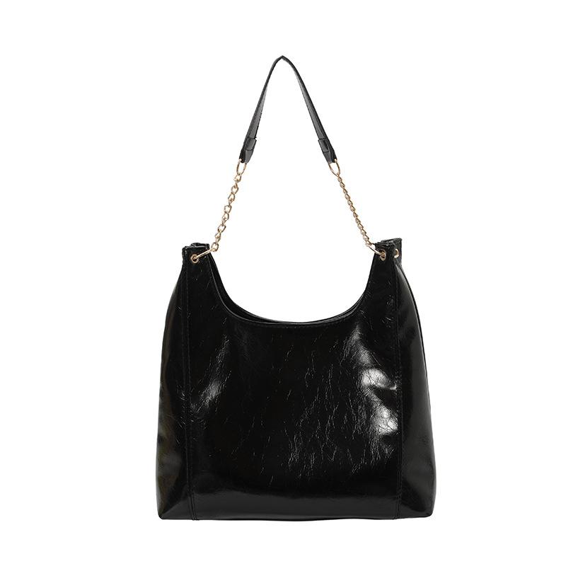 

Large capacity soft leather bag women s new fashion chain shoulder armpit bag solid color casual commuter tote bag чорний