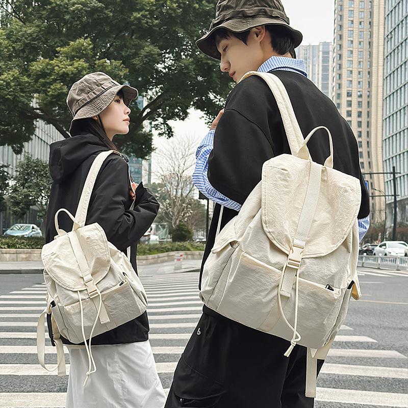 2025 spring new solid color college student backpack women's outdoor leisure large capacity simple high value backpack men