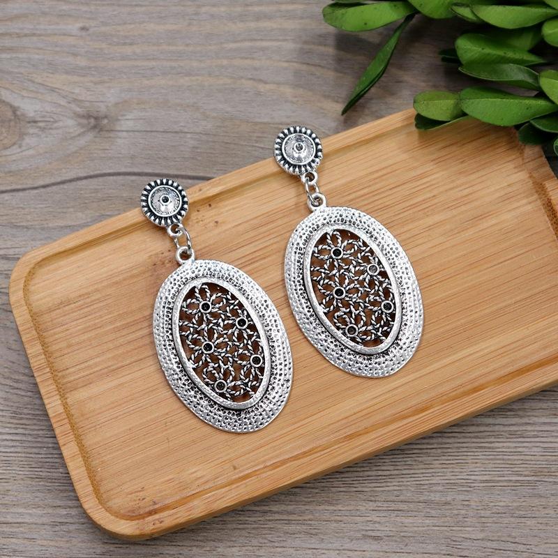 

Ретро серьги-пусеты из тибетского серебра в виде цветка, геометрические длинные женские серьги с характером, темпераментные полые серьги, универсальные серьги для отпуска