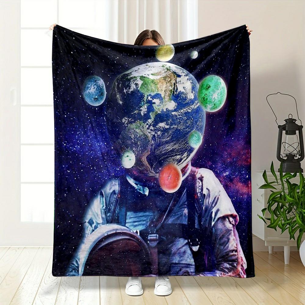 Astronaut with Planet Head in Space Patterned flannel blanket perfect for the bedroom living room, sofa, or a little nap