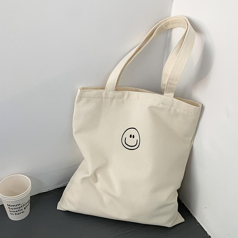 

Versatile Eco-friendly Smiley Face Canvas Bag for College Students