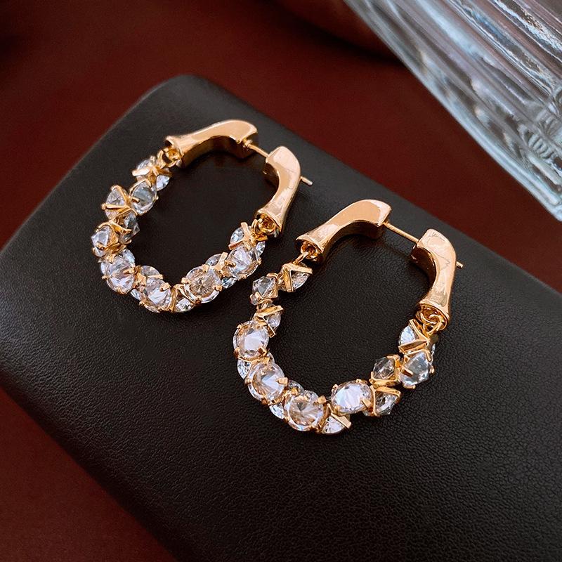 Echtgold-galvanisierte Silbernadel Zirkon Liebesohrringe Leichter Luxus High-End Ohrstecker Nischenohrringe Damen