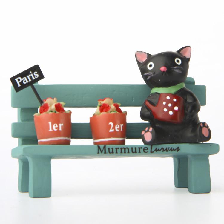 Black Cute Cat Sitting On Bench Watering Flowers Resin Ornaments For Desk Decor