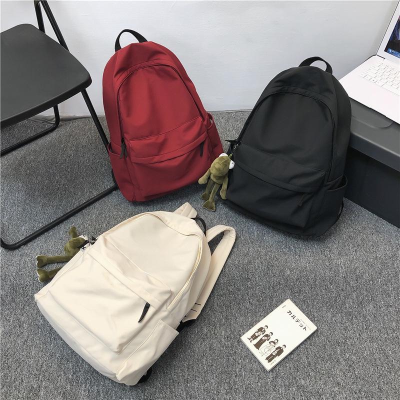Solid color simple version of literary and artistic student schoolbag Korean version of casual style large-capacity backpack