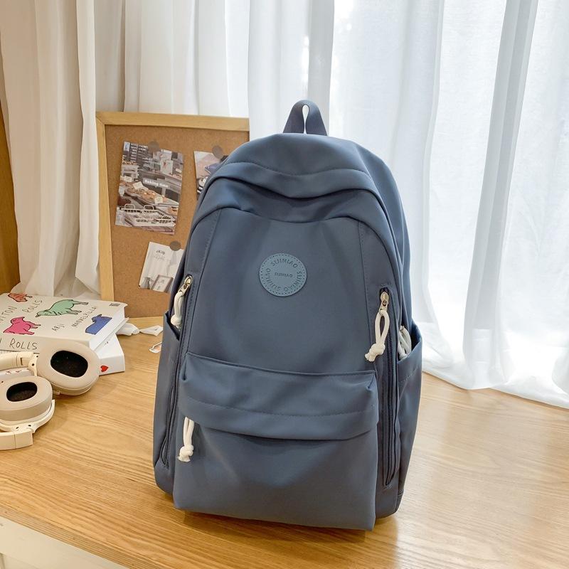 Einfacher einfarbiger leichter Rucksack Mädchen Joker Junior High School Alle Rucksäcke Shopping-Rucksack.