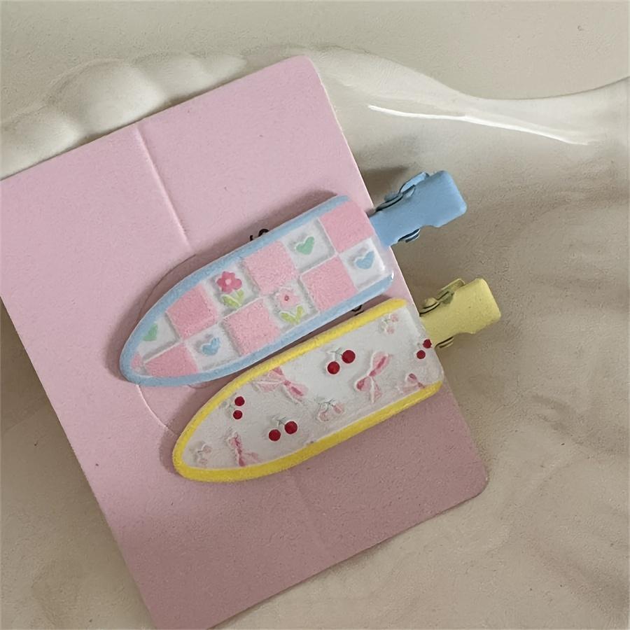 A Set of Two Cute Floral Hair Clips with Polka Dots, Designed for a Youthful Look, Perfect for Holding Bangs Without Leaving Marks.