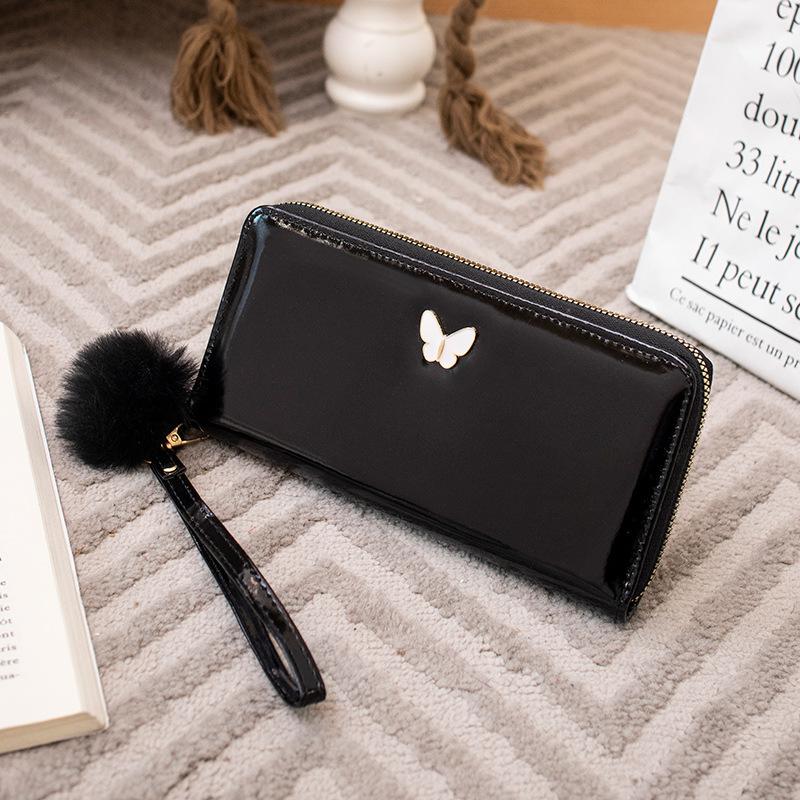 New solid color butterfly label wallet women's long zipper clutch bag hairball simple change bag one piece hair