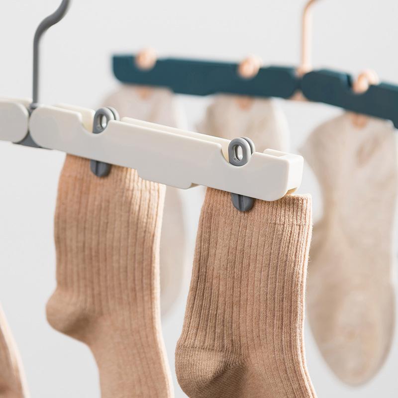 Přenosný věšák s více klipy a protiskluzovými kolíčky pro cestování, venkovní dobrodružství a sušení magických ponožek