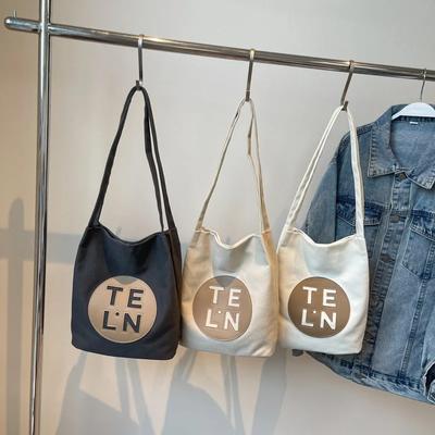 Grenzüberschreitende neue Brief-Canvas-Tasche mit großem Fassungsvermögen für Damen, Nischenmode, Schultertasche, Messenger-Tasche für Studenten, lässige Tragetasche