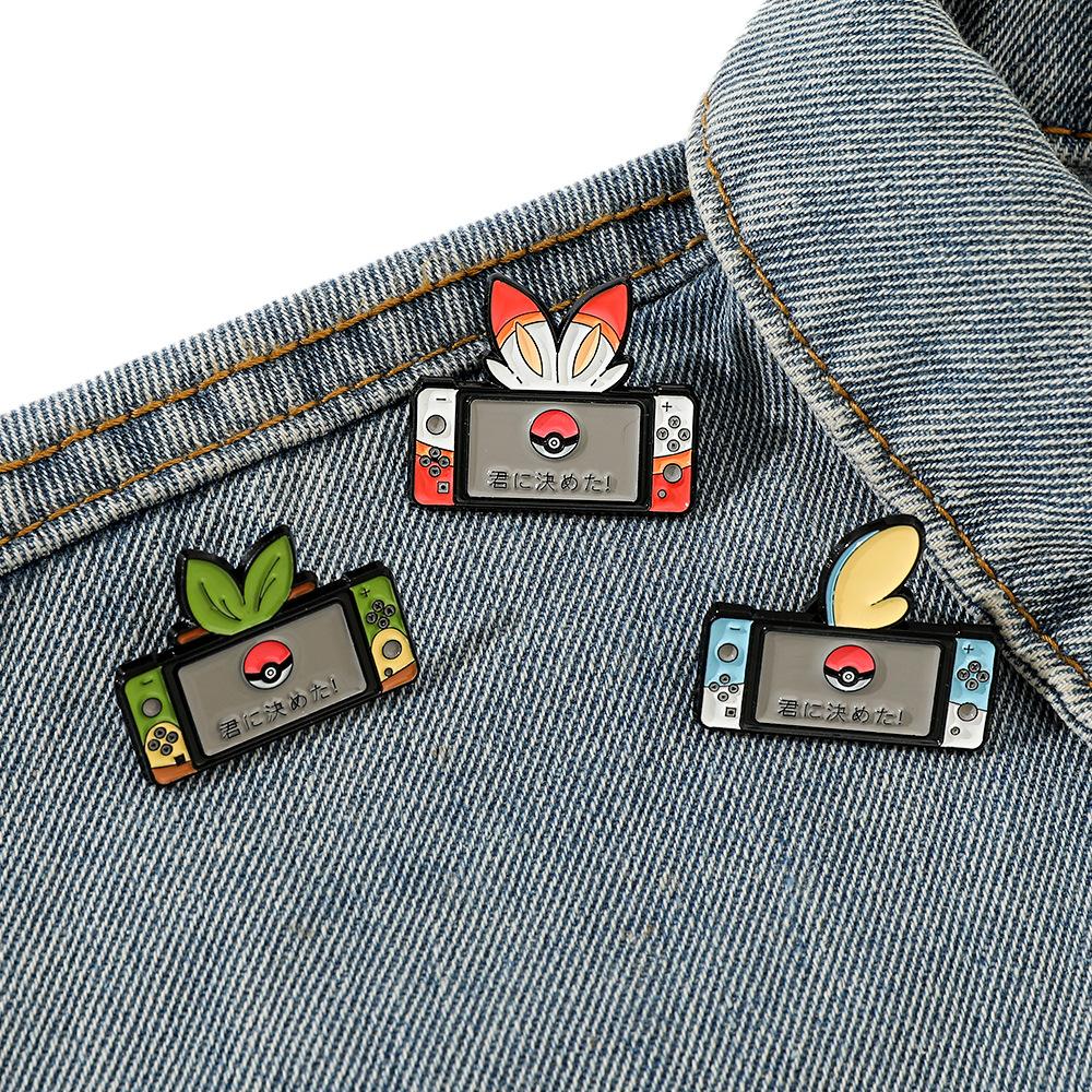 Japanese cartoon creative game console shape Pokémon metal badge Pokémon elf ball brooch