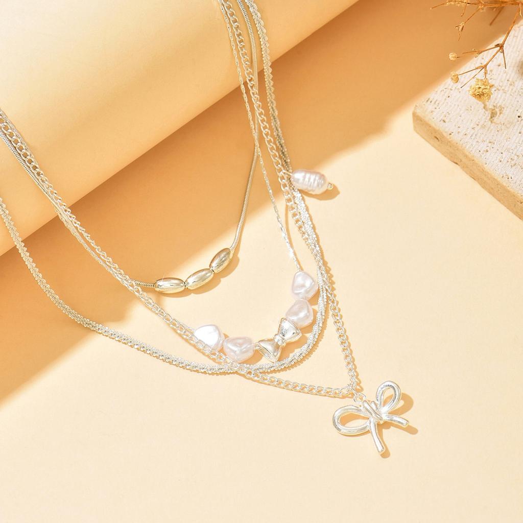 Wear Bow Collarbone Chain Wholesale European and American Multi-layer Stacked Accessories Niche Imitation Pearl Light Luxury High-end Necklace