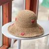 An Insta-style wavy edge large eaves straw fisherman hat women's summer braided love straw hat holiday beach breathable sunshade