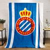 A blue background with white stripes and a crowned red circular emblem. for all seasons blanket lunch break throw gift