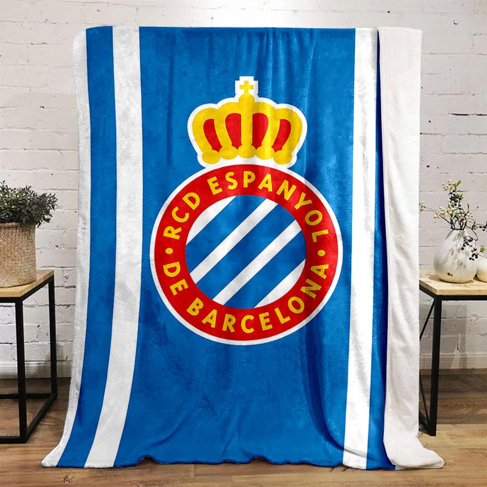 A blue background with white stripes and a crowned red circular emblem. for all seasons blanket lunch break throw gift