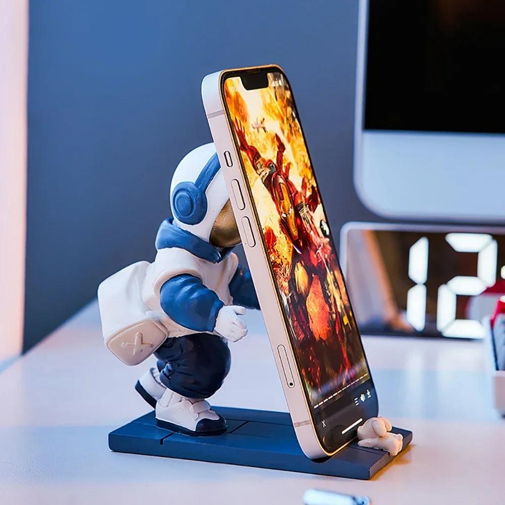 Künstlerische Astronauten-Ornamente Büro-Schreibtischdekoration Astronauten-Halter Handy-Ständer Halter Spielzeug Geschenk Schlafzimmerdekoration
