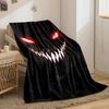 Sinister, glowing red eyes and sharp white teeth in a dark background. for all seasons blanket lunch break throw gift