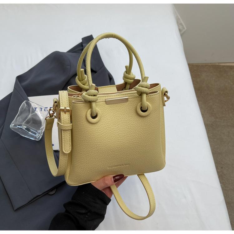 

Fashion niche commuter portable small bag women s 2025 new simple texture bucket bag women s shoulder messenger bag