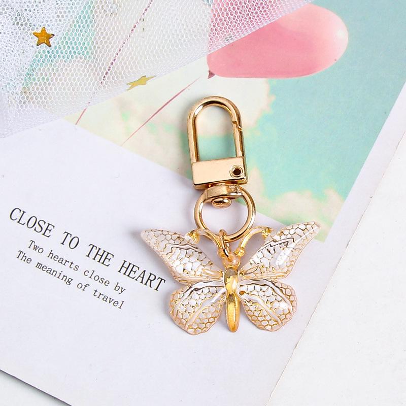 Gradient Butterfly Pendant: Iridescent Keychain Charm for Backpack or Earphone Case.