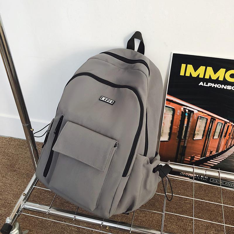 

Casual versatile large-capacity backpack female new student schoolbag niche sports travel backpack серый