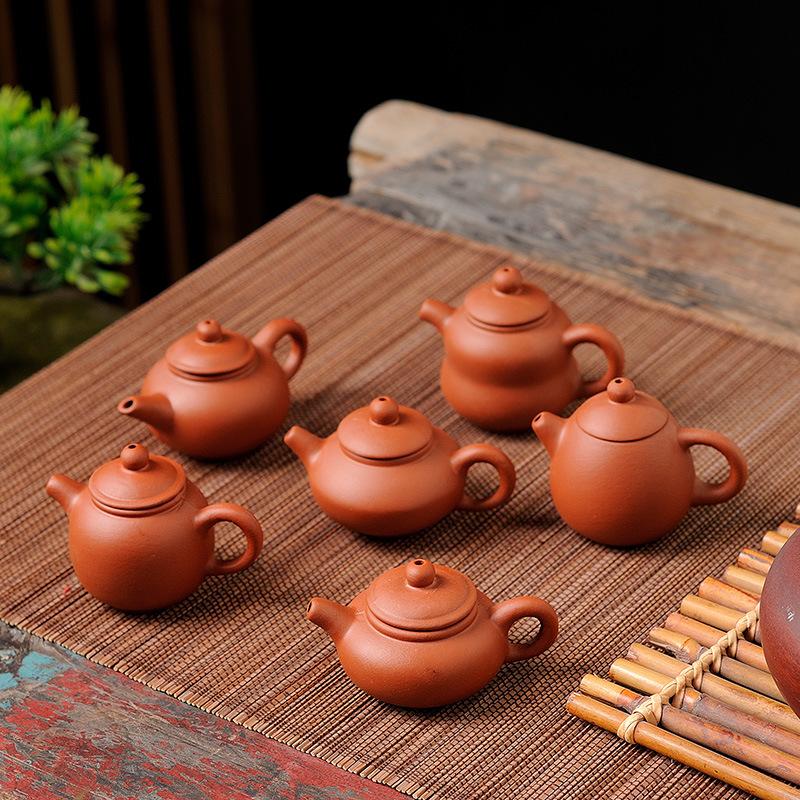 Mini purple sand children's set handle pot small teapot fingertip pot tea pet pot can be placed to raise Xishi small kung fu tea set