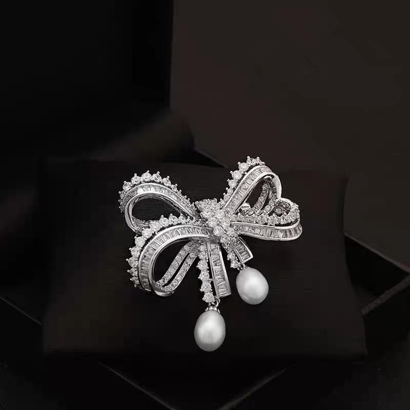 European and American light luxury bow bead pendant brooch new fashion accessories women's suit coat exquisite temperament pin