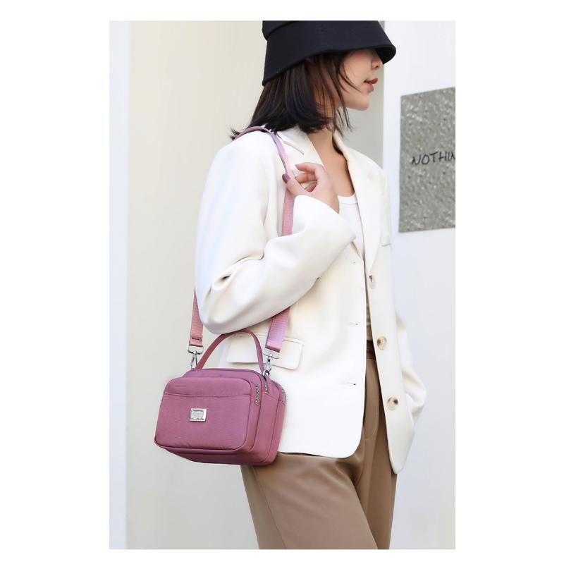 Bolsa feminina de tendência de rua portátil de um ombro crossbody bolsa de mãe feminina da moda
