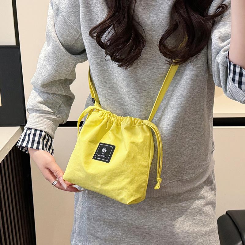 Mobile phone bag women's simple versatile drawstring messenger bag trendy brand shoulder bag leisure sports nylon bag