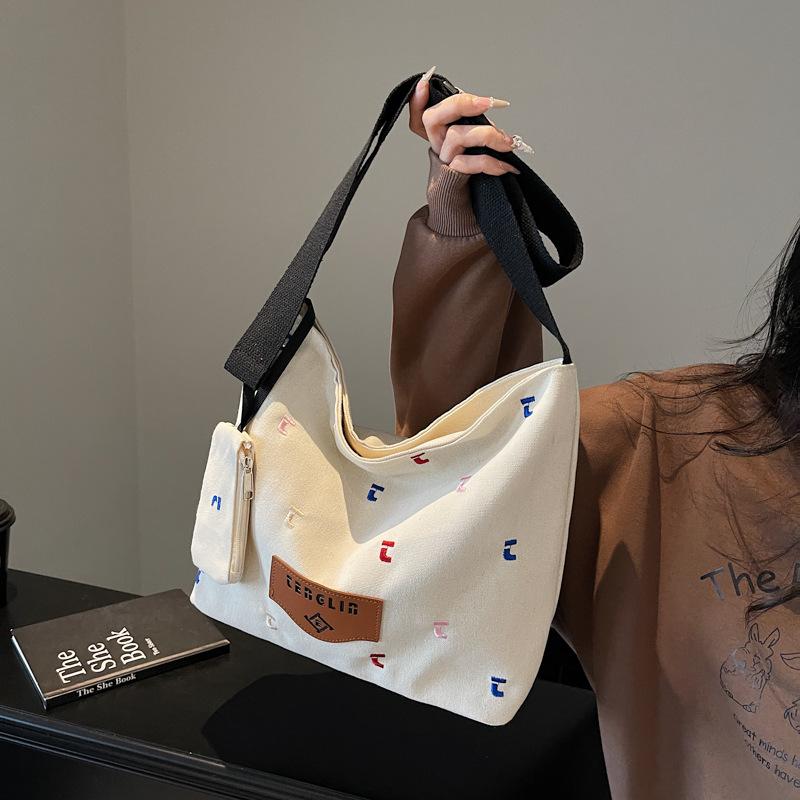 

ins canvas bag women s 2025 new letter embroidered shoulder bag women s simple American large-capacity literary messenger bag хаки