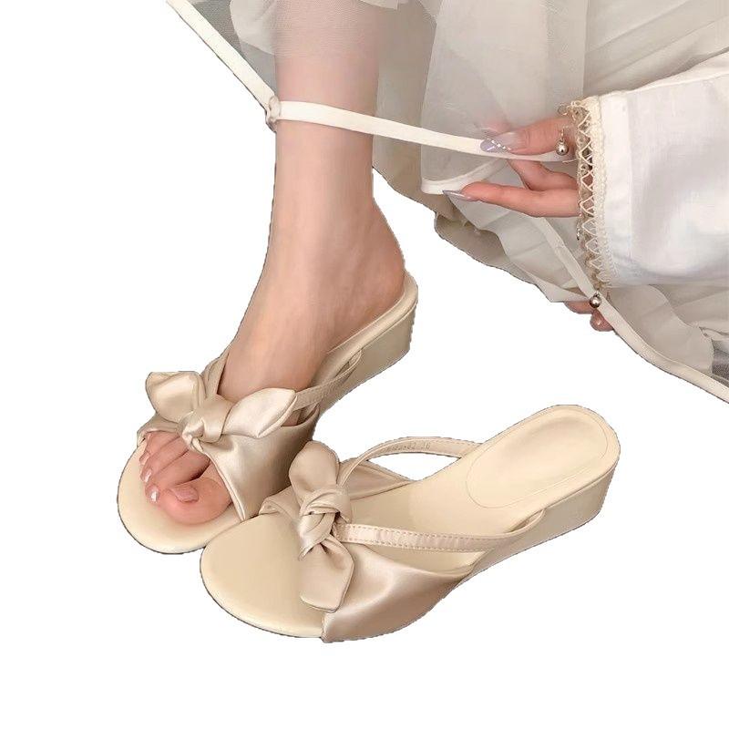 2025 new French white bow thick-bottomed one-word slippers women's summer can wear fashionable low-heeled cool slippers