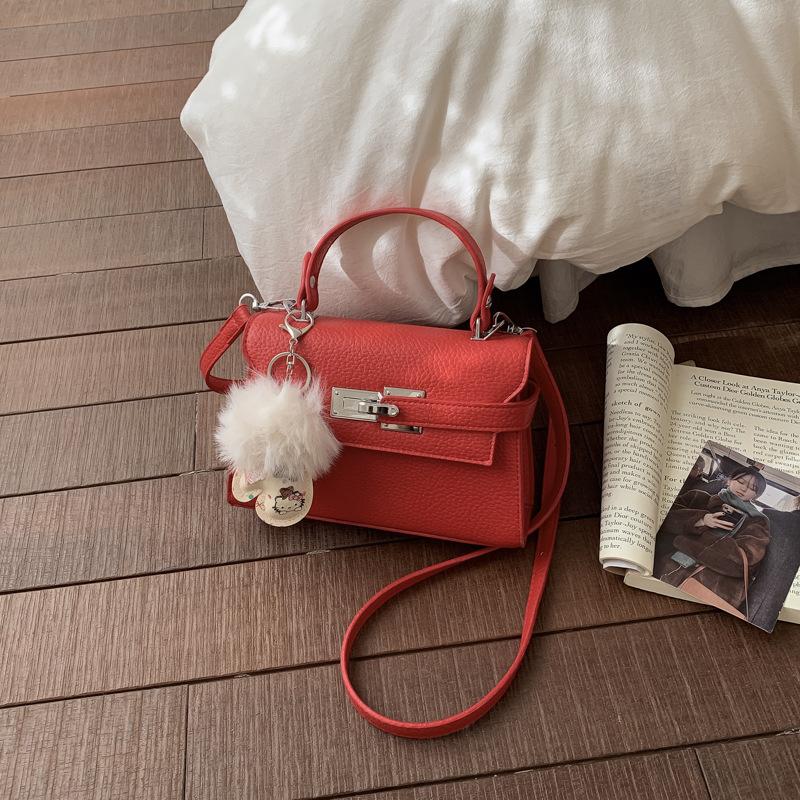 Elegant Commuting Bag for Work with A Chic Kelly Bag Style, Single-shoulder Cross-body Design.